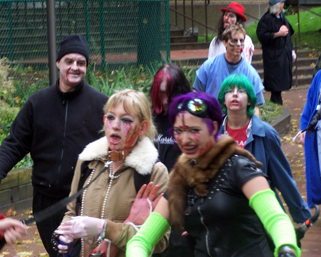 a group of people in costumes pose for the camera