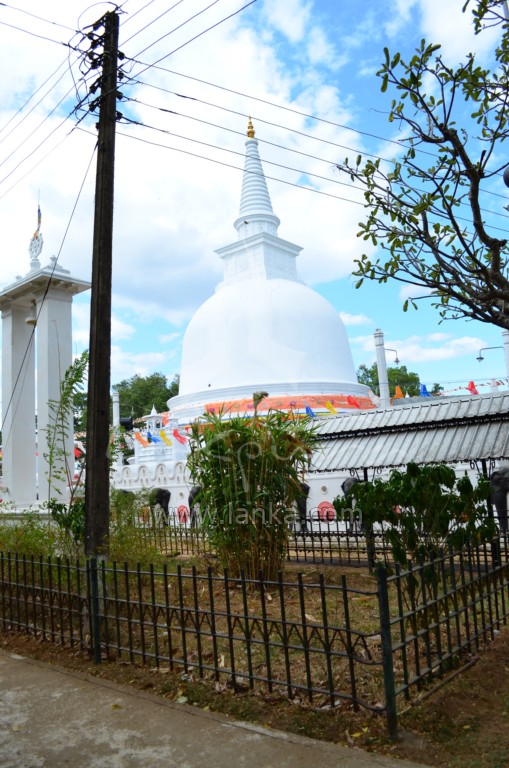 a white church surrounded by power lines