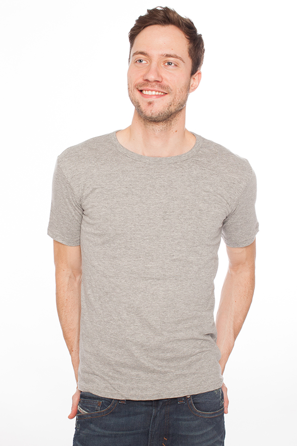 a smiling young man wearing a gray shirt