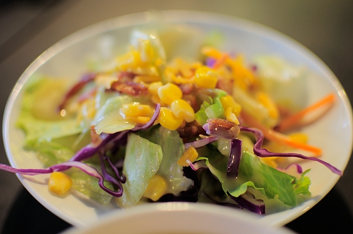 this is a salad in a bowl on top of a table