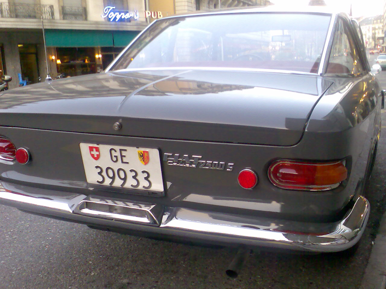 a grey sports car in a parking space