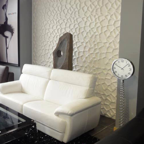 a contemporary white leather sofa in a room