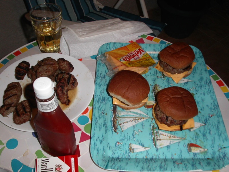 hamburgers and tater tots sit on top of a plate