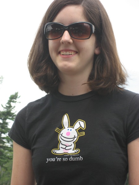 a woman is wearing a rabbit t - shirt