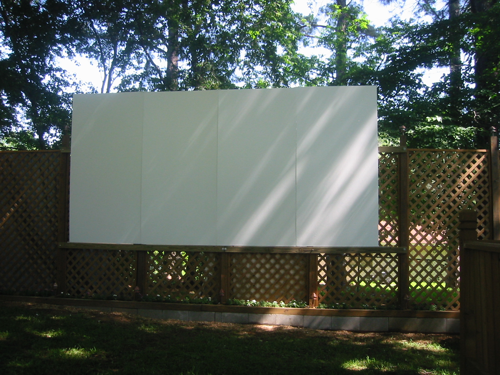 a big screen that is in a fence