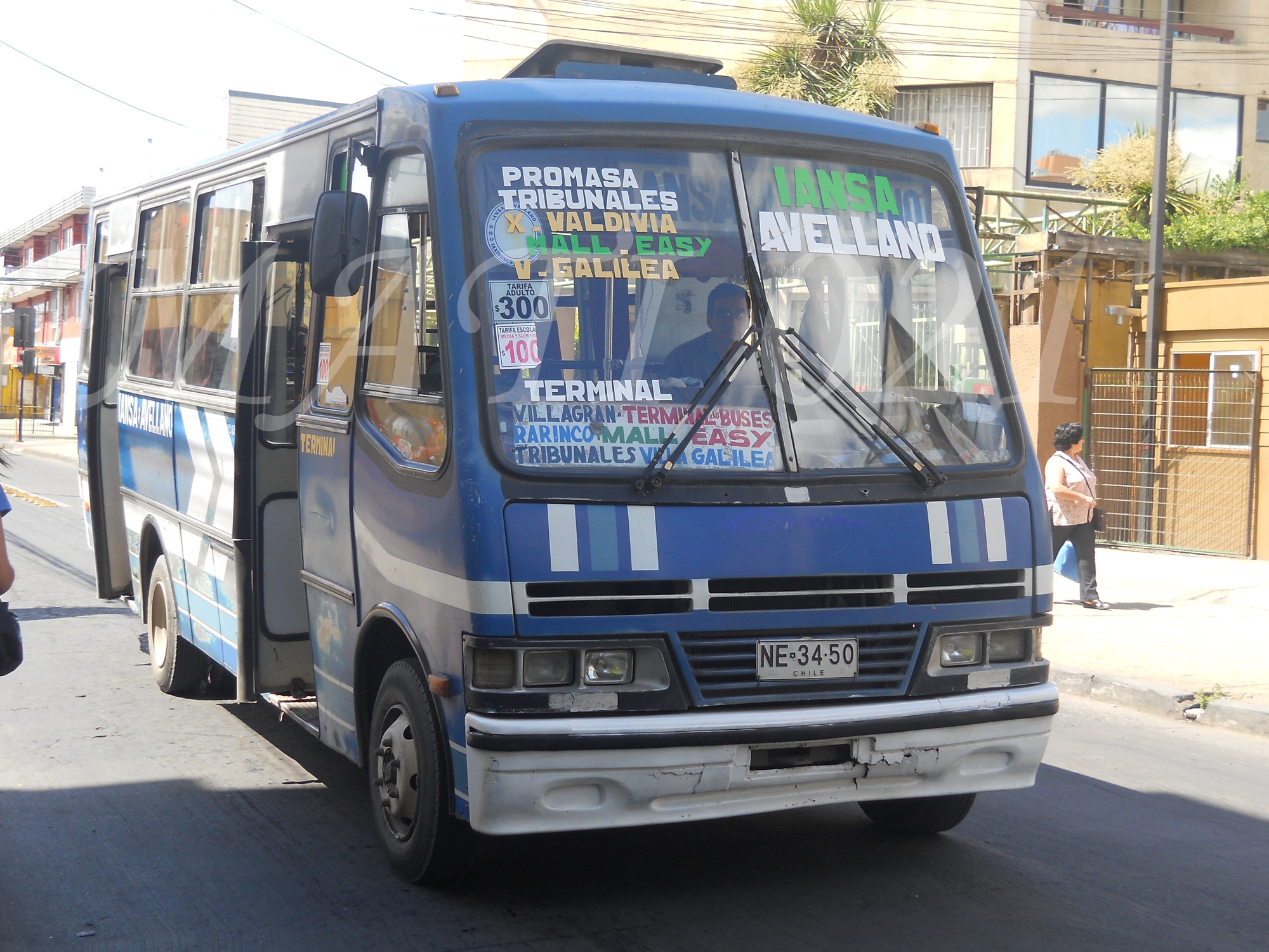 the bus has many advertits on it's front windows