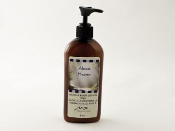 a bottle of hand and body lotion on a white background