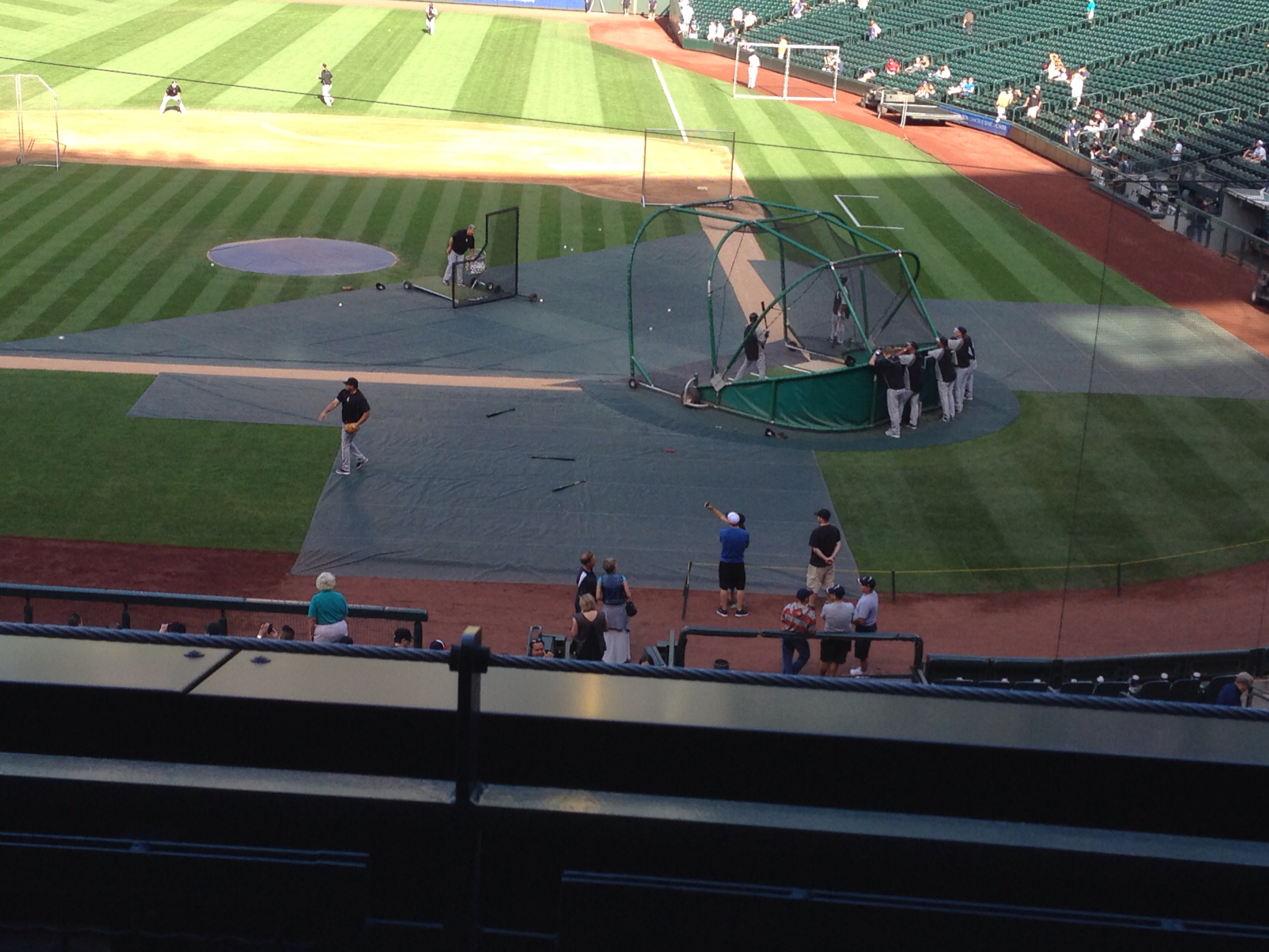 a stadium filled with baseball players standing on top of a field