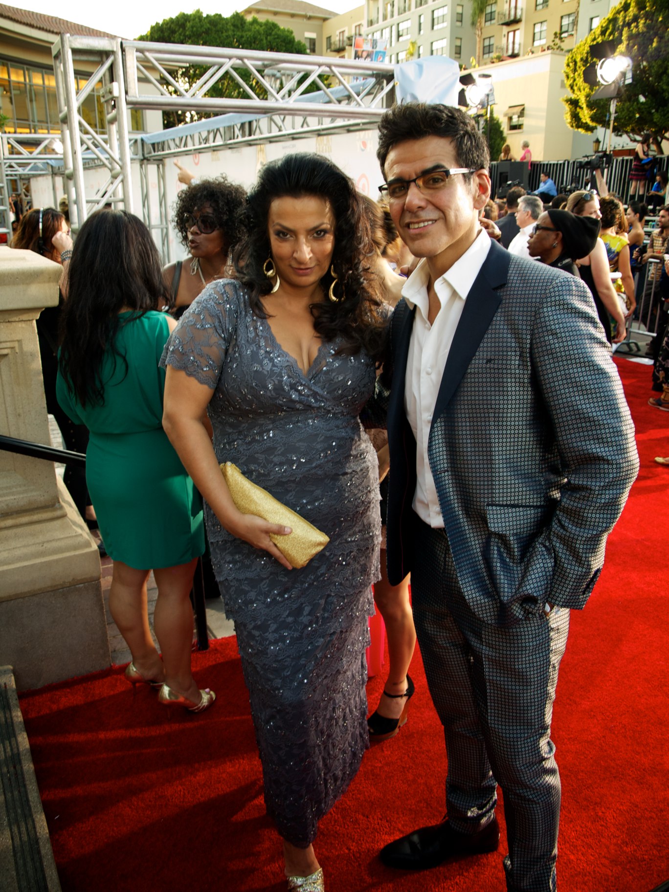 man and woman posing at a red carpet event