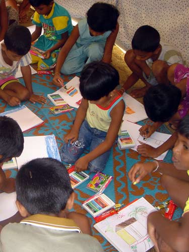 a group of children doing their work on a project