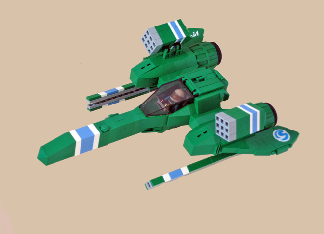 a green toy aircraft flies through the sky