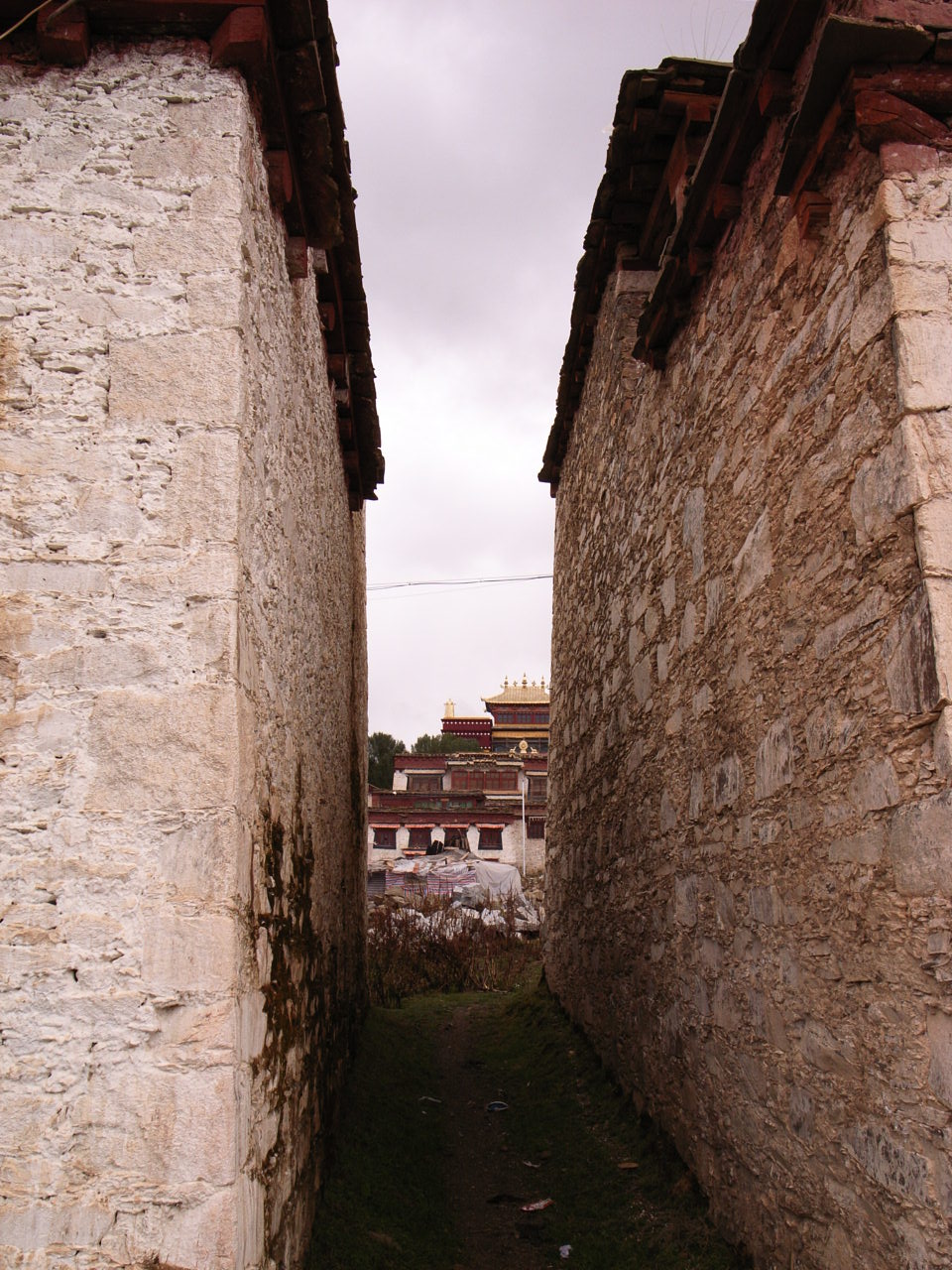 an image of a narrow street in a small town