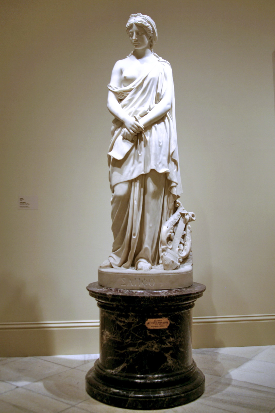a white statue in an art museum