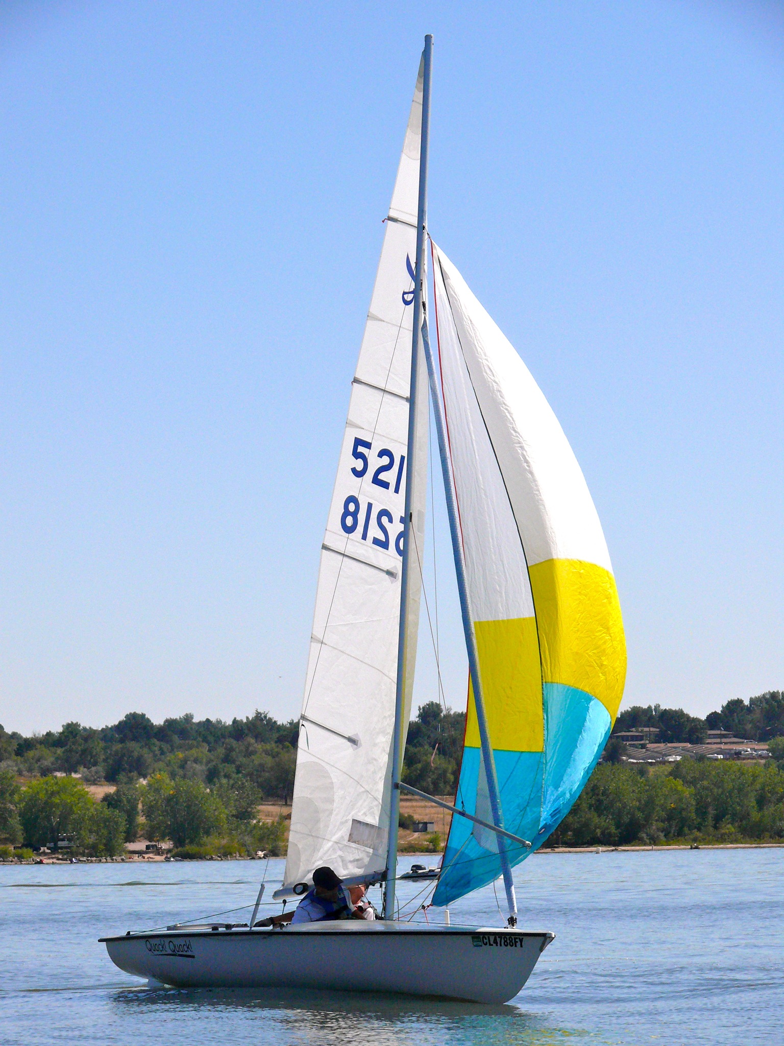 the sailboat is traveling fast on the lake