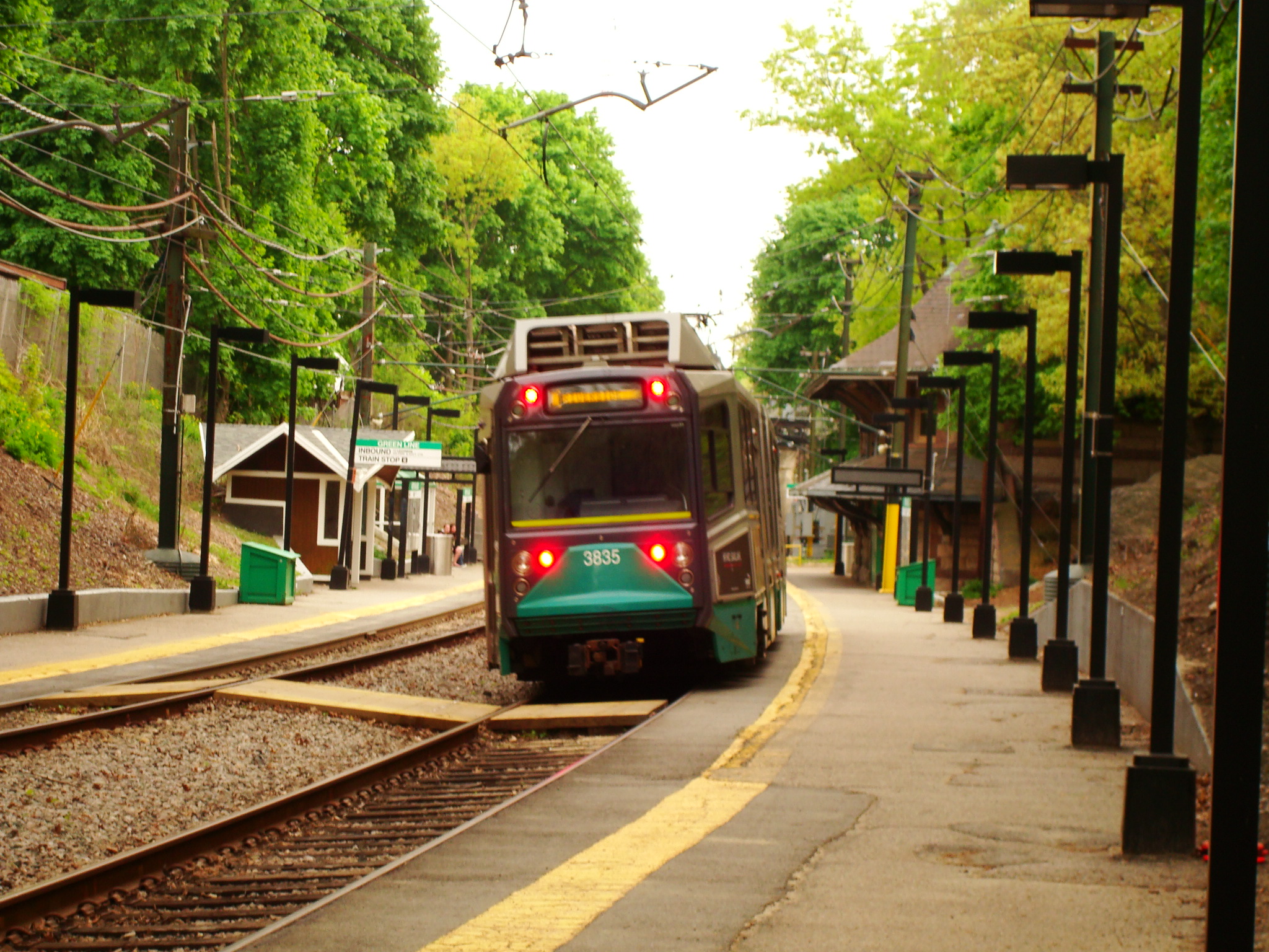 a train engine carrying carts into a station