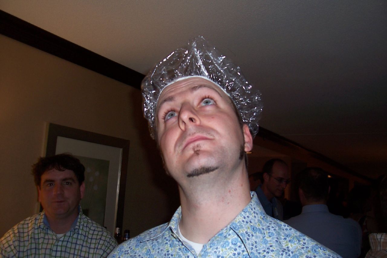 a man with a plastic bag over his head staring up