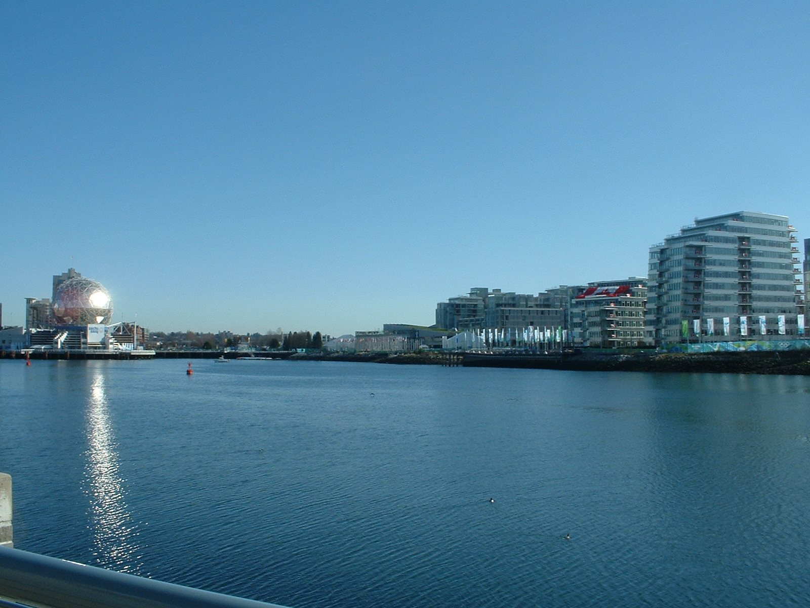 a city on a river bank near the ocean