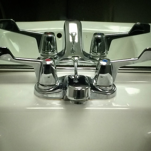 a bathroom sink with chrome faucets in the sink