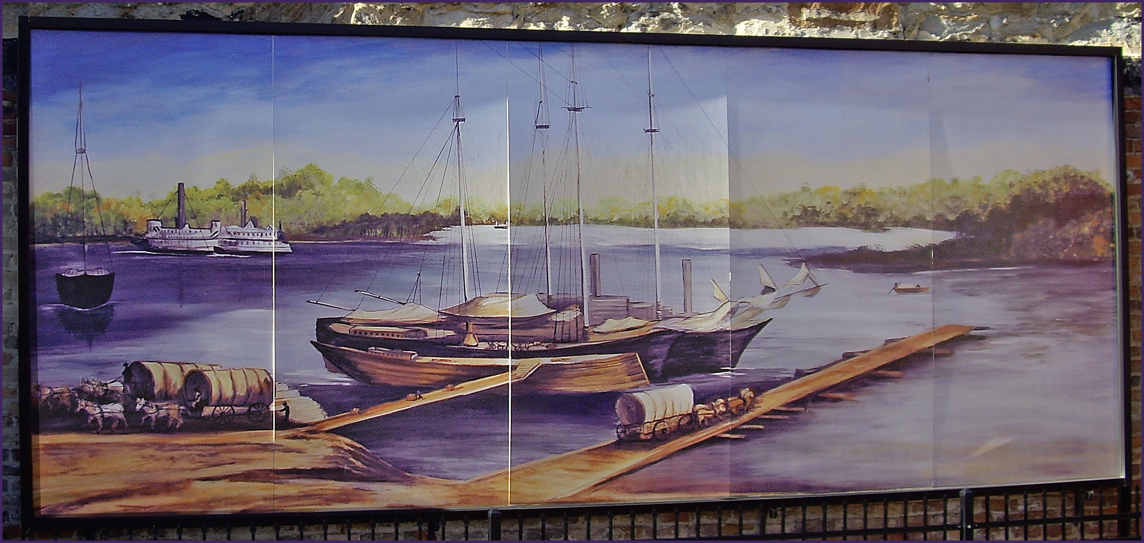 a painting on a wall depicts boats on the water