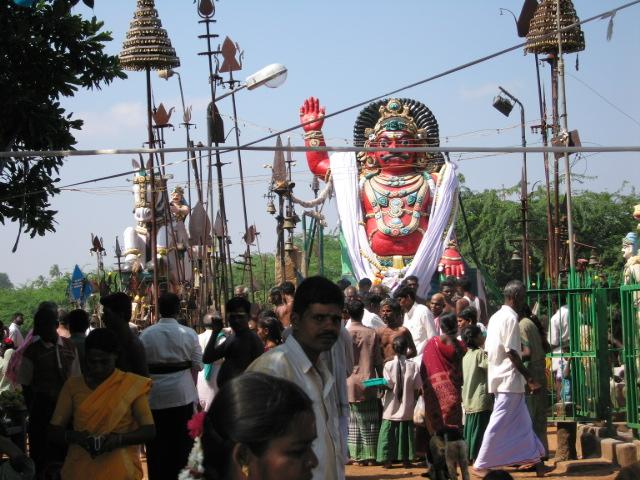 an open air temple is crowded with people