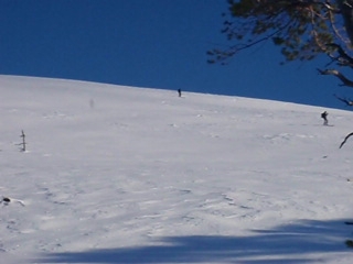 a man is skiing down a very steep hill