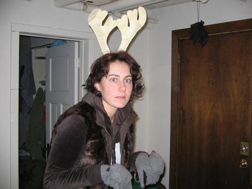there is a woman that is wearing deer antlers on her head