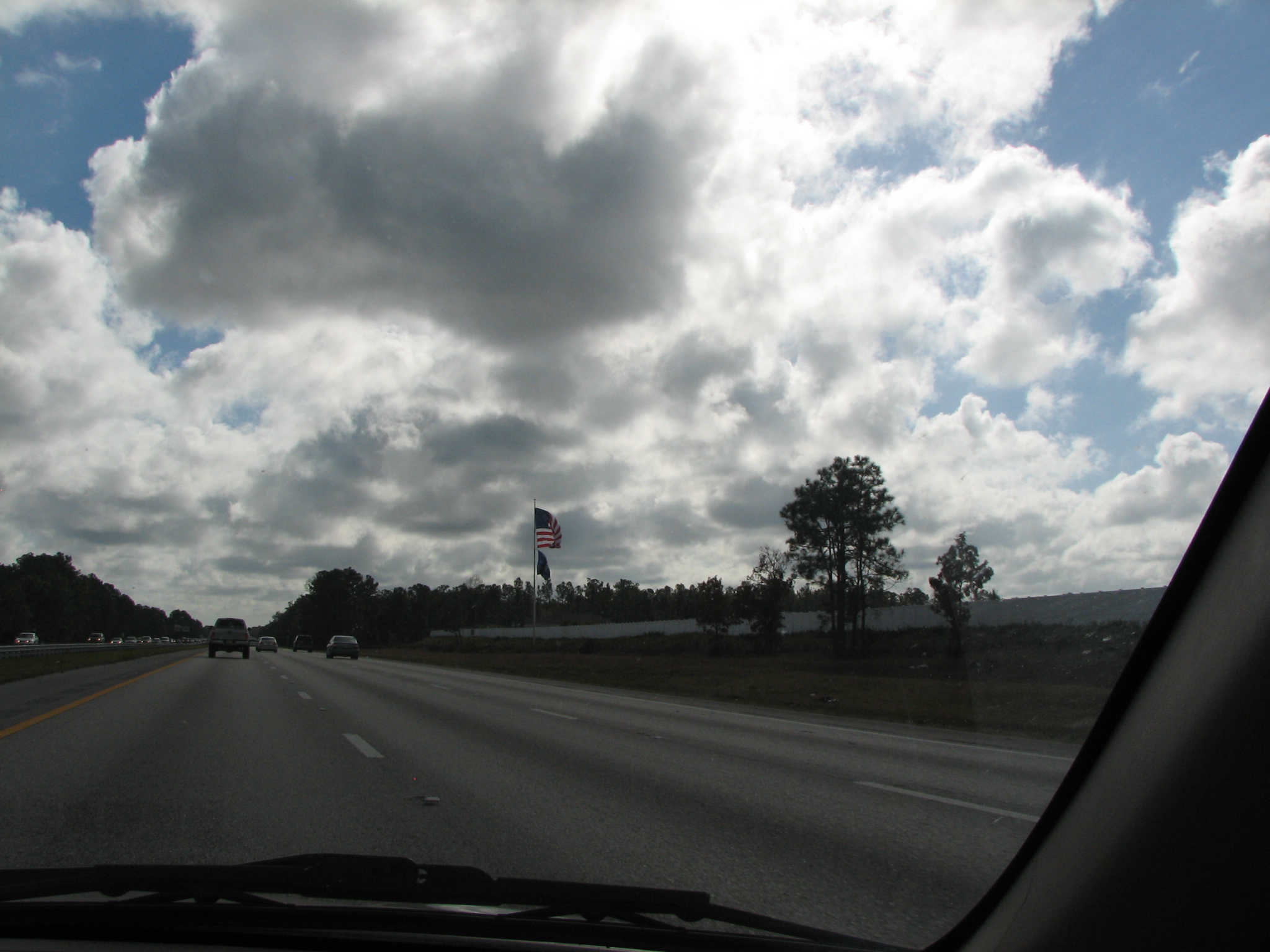 the view from inside the car looking down the road