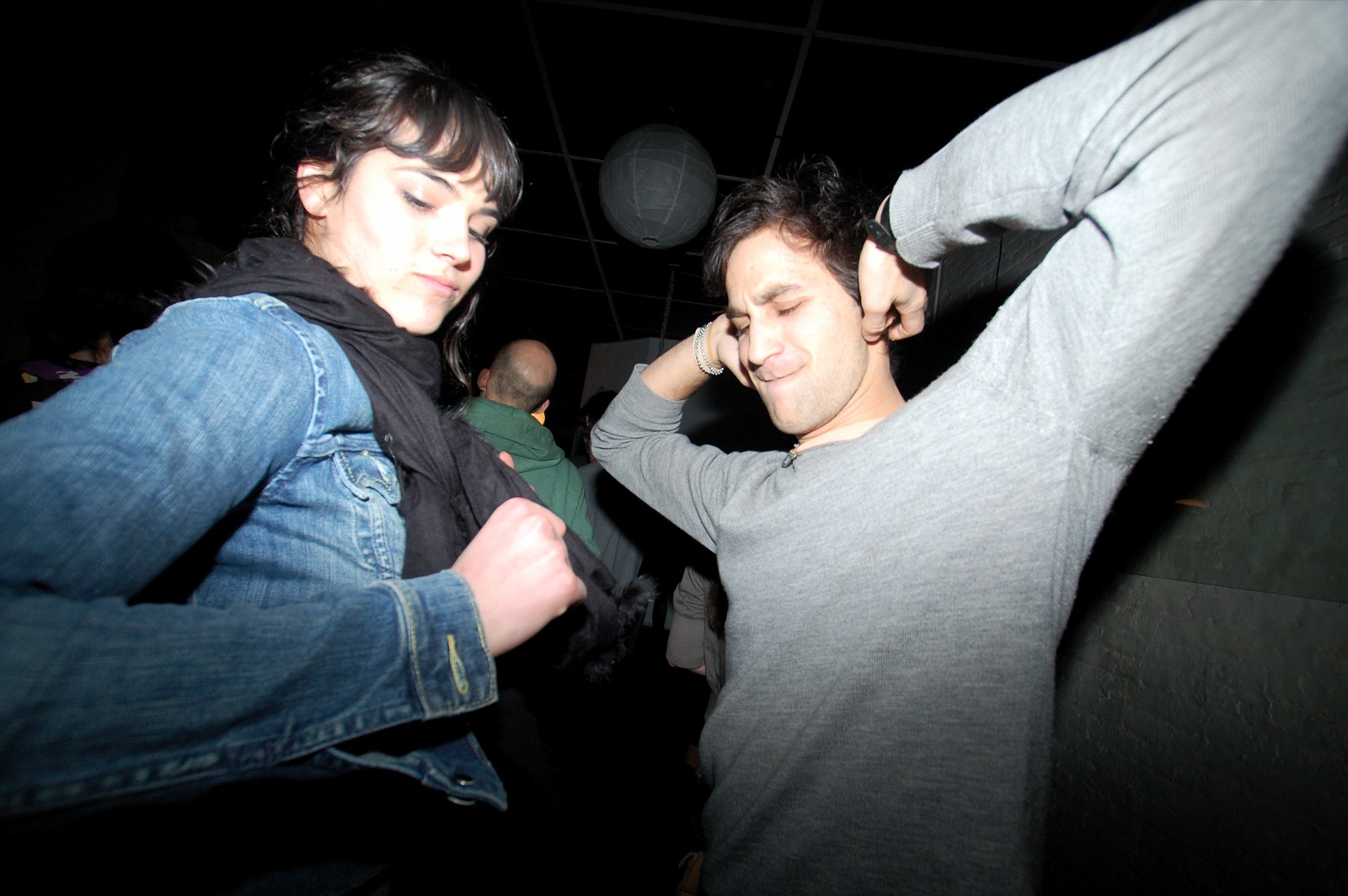 a person wearing a jean jacket and a man in grey t - shirt