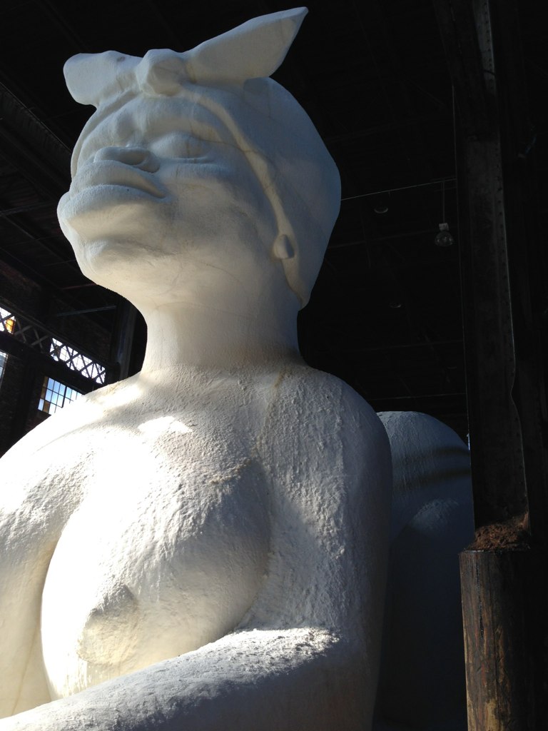 the large white sculpture is in an enclosure