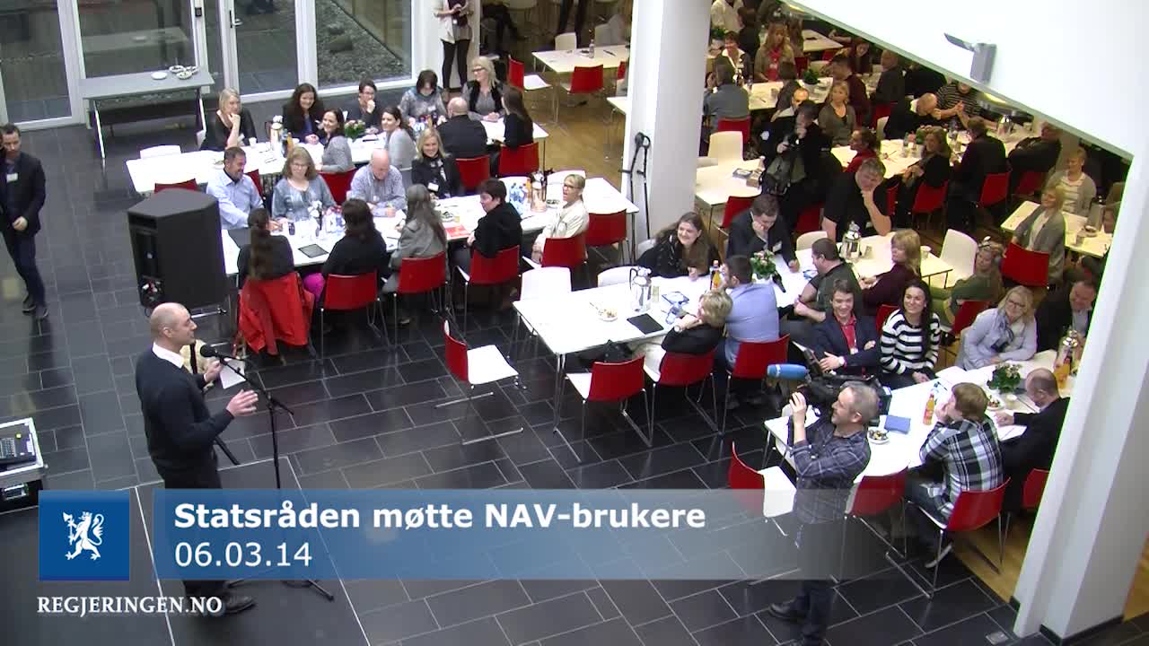 an overhead view of people in red chairs eating at tables