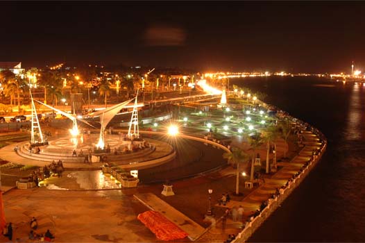 an aerial view of a city with lots of lights at night