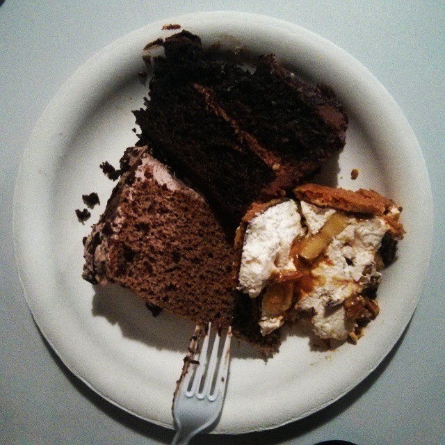 a white plate topped with lots of chocolate cake