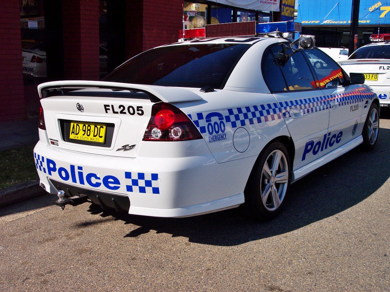 there are two police cars parked next to each other