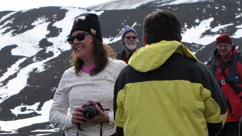 a group of friends hanging out on the slopes taking in the view