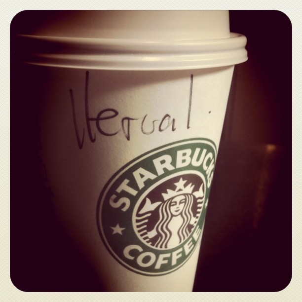 a starbucks cup with the words'starbucks'written on it