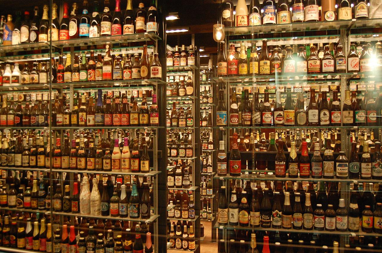 a store display case filled with lots of beer bottles