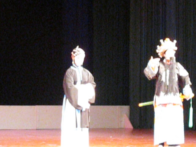 two people in a line performing a show