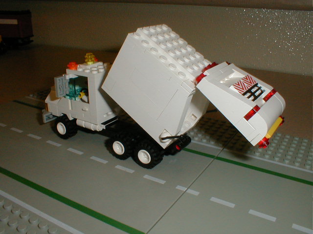 a truck is made out of legos and it's on the table