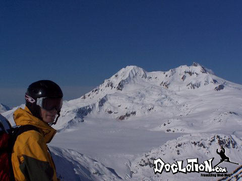 a man with a ski and a helmet on a mountain