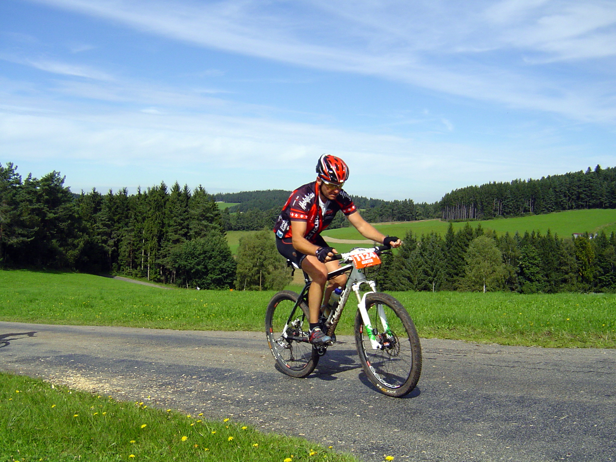 a person on a bicycle going up a hill