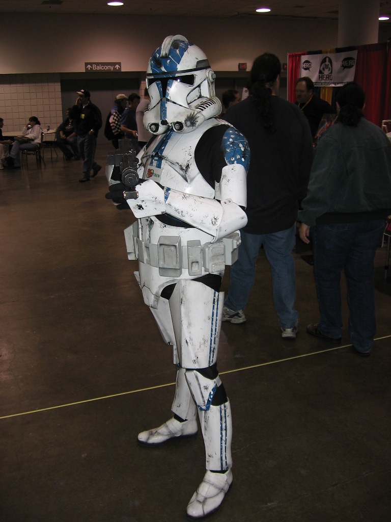 a star wars clone trooper dressed in white and blue paint