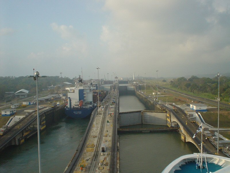 a barge going through a lock on a river