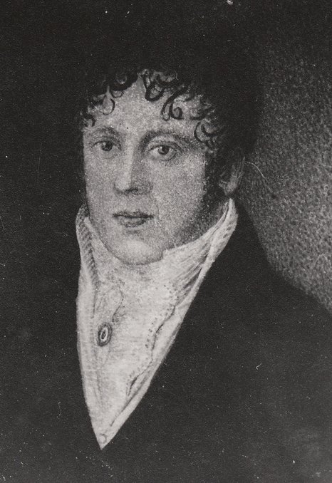 there is an old pograph of a man with curly hair