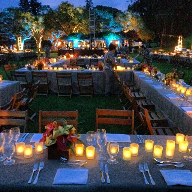 a large dining area with several lights in the center