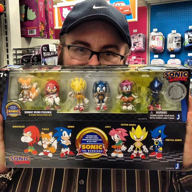 a man holds up a toy with many toys in it