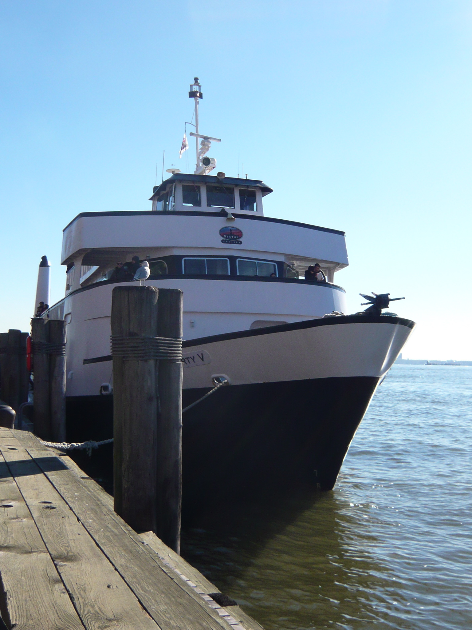 a large white boat is parked at the dock