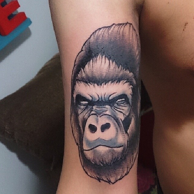 this tattoo features a gorilla with a mohawk
