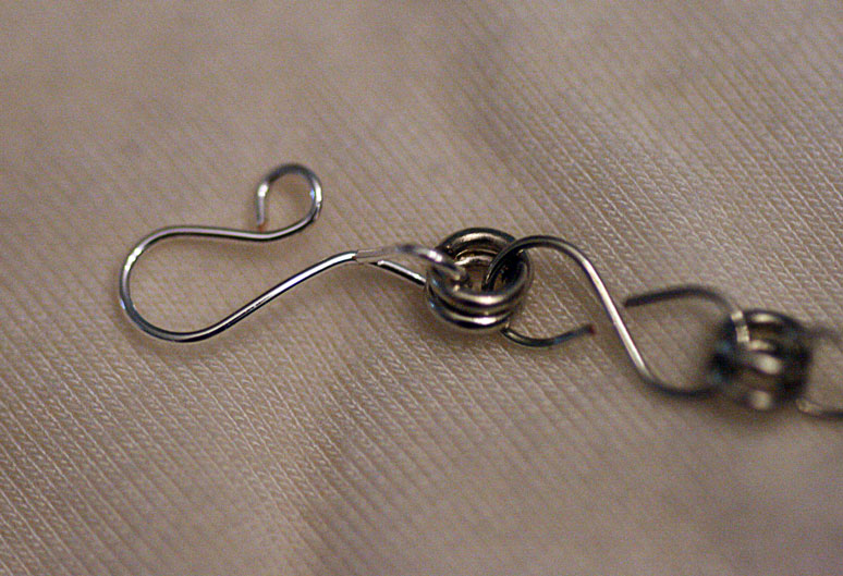 a metal scissors with two heart shaped holes