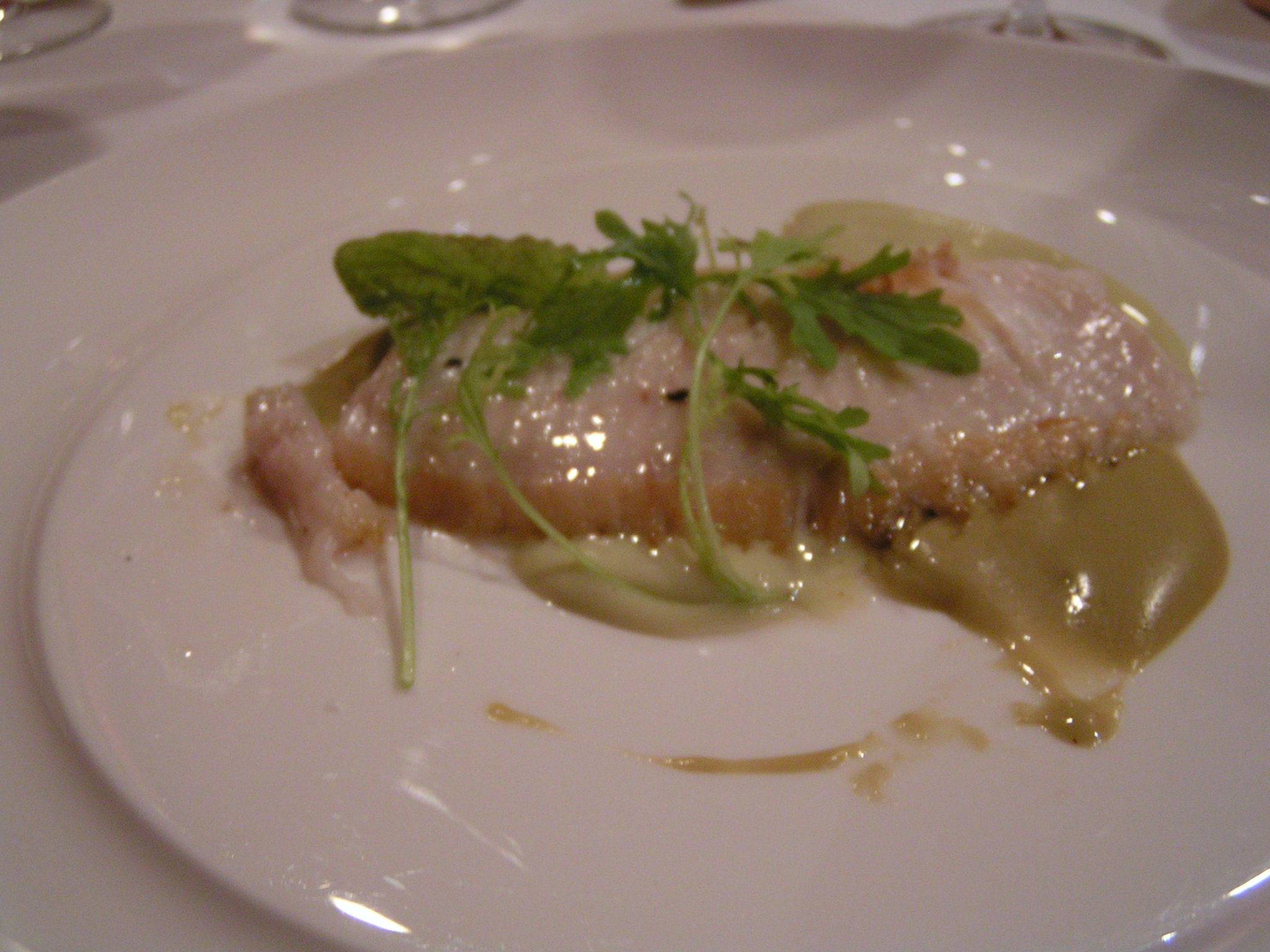 a white plate topped with food on top of a table