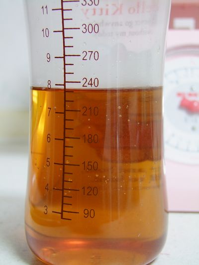 a large measuring cup with some liquid in it